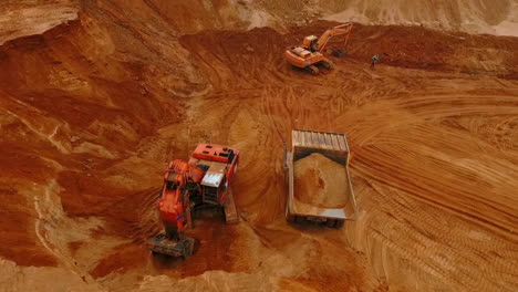 Aerial-view-of-mining-machinery-working-at-sand-quarry.-Mining-equipment