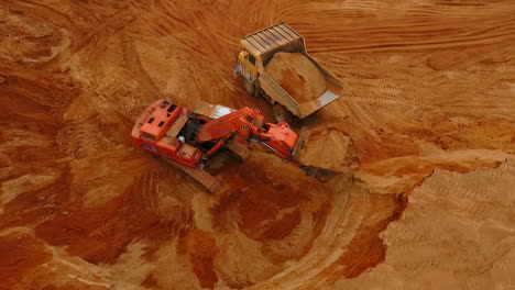 Mining-industry.-mining-excavator-loading-dumper-truck.-Mining-machinery