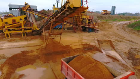 Mining-conveyor-pour-sand-in-dumper-truck.-Sand-mining.-Mining-machinery