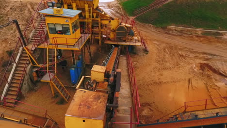 Drone-view-of-sand-moving-on-automatic-conveyor-belt.-Industrial-mining-conveyor