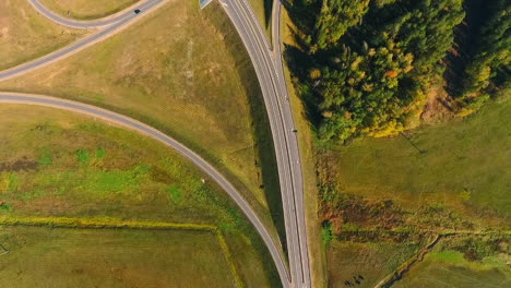 Aerial-view-road-junction.-Cars-driving-at-highway-junction