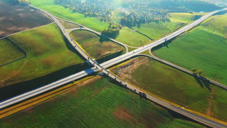 Drone-view-cars-moving-on-highway-junction.-Landscape-road-junction-on-highway