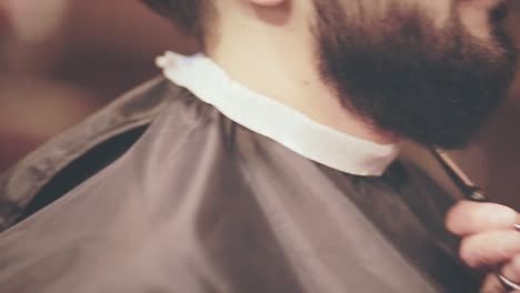Hairdresser-working-with-man-beard.-Bearded-man-in-barbershop