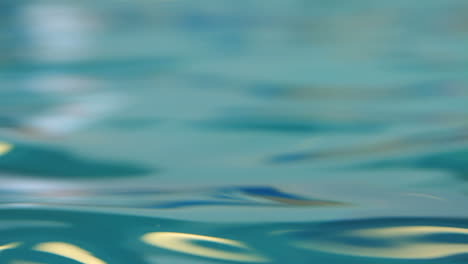 Water-background.-Closeup-of-smooth-water-surface.-Shiny-water-surface