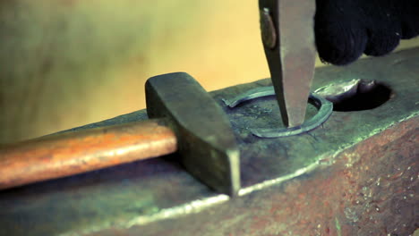 Iron-horse-horseshoe-lie-on-anvil.-Blacksmith-making-metal-horseshoe