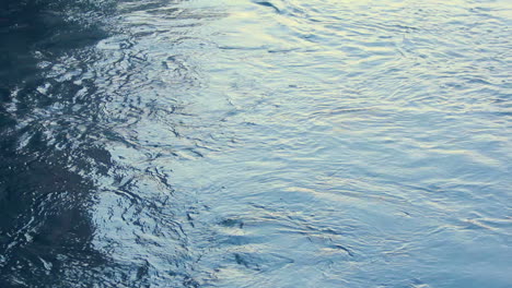 Water-surface-ripples.-Water-background.-Sunlight-in-water-waves.-Blue-water
