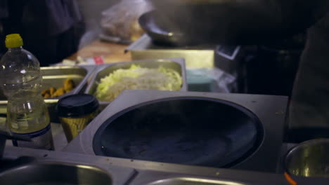 Cooking-wok-food.-Wok-cooking.-Asian-food-being-cooked-in-wok-pan