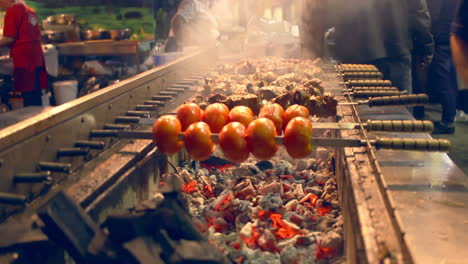 Grilling-tomato-and-meat-on-skewers.-Outdoor-grill-restaurant