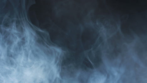 Smoke-abstract.-Smoke-cloud.-Smoke-on-black-background-in-blue-light