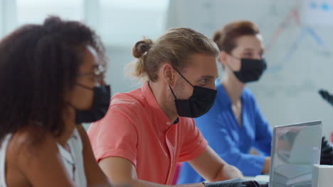 Masked-people-working-office.-Business-team-wearing-gloves-and-mask-in-boardroom