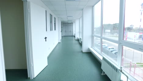 Pov-of-walking-lab-corridor.-Steady-cam-shot-of-laboratory-corridor