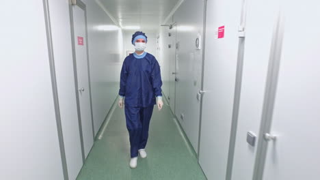 Lab-worker-go-in-sterile-corridor.-Scientist-in-laboratory-corridor