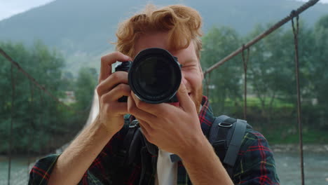 Hiker-taking-picture-on-camera-lens-closeup.-Photographer-enjoy-summer-mountains