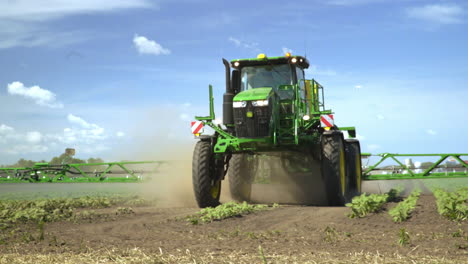Agricultural-sprayer-irrigating-farming-field.-Spraying-machine