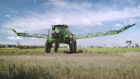 Agricultural-sprayer-transformed-after-watering-works-on-field.-Spraying-machine