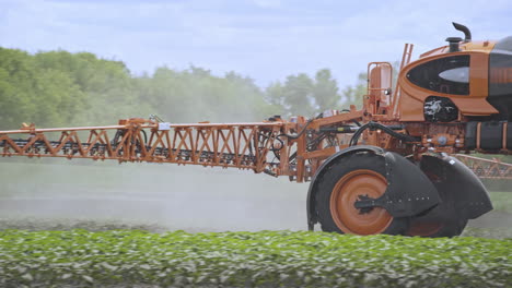 Agriculture-spraying-pesticides.-Fertilizer-spreader-spraying-field