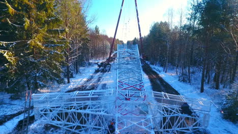 Electricity-work-in-winter-forest.-High-voltage-power-lines.-Electricity-tower