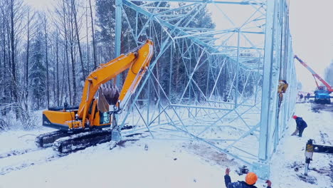 Industrial-machine-on-installation-high-voltage-tower.-Energy-electricity-work