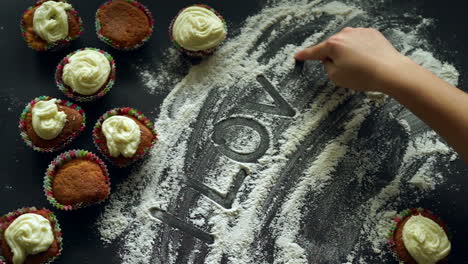 Sweet-love-concept.-Inscription-I-love-you-on-white-flour-kitchen-background