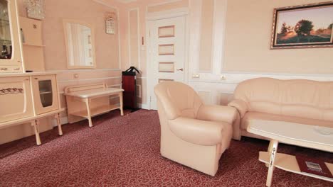 Room-furniture-sofa-and-armchairs-for-recreation-in-hotel-apartment