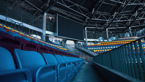 Empty-sports-stadium-with-nobody-from-tribune-and-big-scoreboard