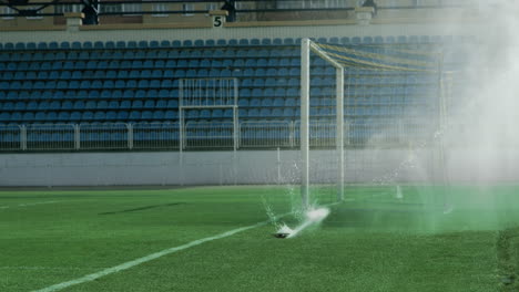 Water-jets-sprinkling-on-green-grass-of-soccer-stadium.-Sports-field-watering