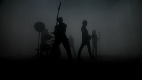 Rock-band-silhouettes-performing-rock-concert-on-stage.-Rock-music-band