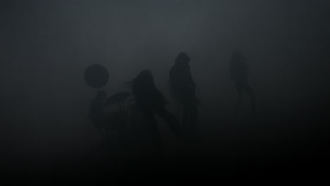 Musical-group-silhouette-in-smoke-at-studio.-Rock-band-concert.-Rock-music-show