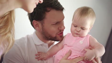 Father-kissing-baby-girl.-Dad-kiss-daughter-infant-at-home.-Male-tenderness
