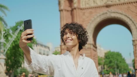 Portrait-of-smiling-man-taking-selfie-photo.-Guy-winking-for-mobile-picture.