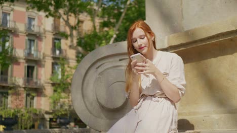 Portrait-of-young-woman-looking-mobile-phone.-Pretty-woman-texting-cellphone