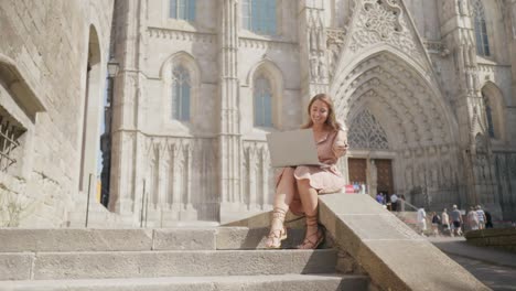 Pretty-woman-working-laptop-outdoor.-Smiling-businesswoman-looking-laptop-screen