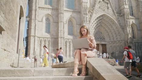 Business-woman-sitting-with-laptop-outdoor.-Girl-getting-message-on-computer