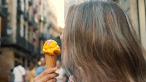 Close-up-cute-woman-eating-gelato-outdoor.-Pretty-girl-licking-ice-cream.