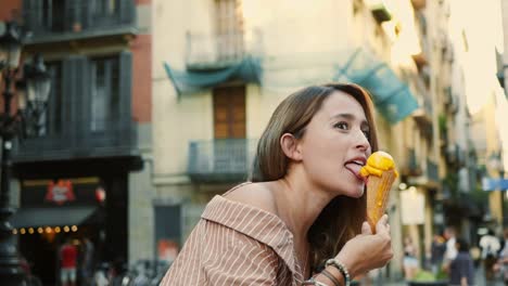 Cheerful-woman-licking-icecream-outdoor.-Cute-girl-eating-melting-ice-cream