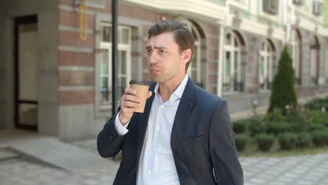 Man-drinking-coffee-before-work.-Businessman-looking-at-smart-watch