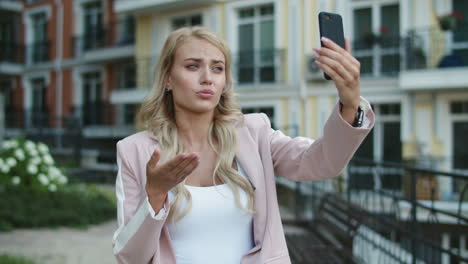 Closeup-businesswoman-walking-with-phone-.-Woman-using-video-call-on-phone