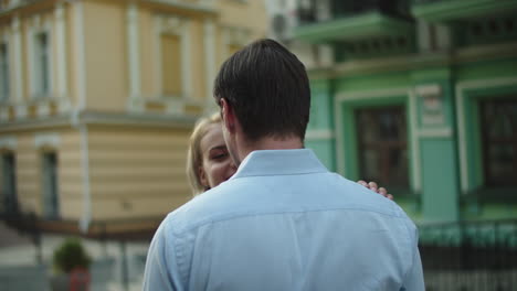 Closeup-couple-smiling-at-date-at-city-street.-Couple-standing-together-outside