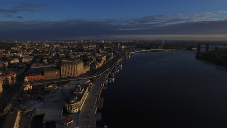 Aerial-view-evening-panorama-Kiev-city-on-Dnieper-river-embankment