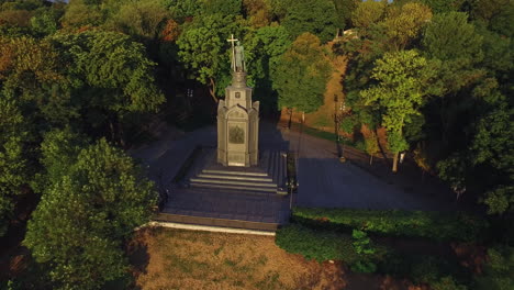 Aerial-view-monument-saint-Prince-Vladimir-with-cross-in-green-park-Kiev-city