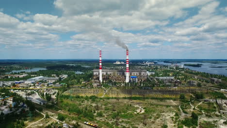 Industrial-factory-exterior-with-smoke-from-chimney.-Aerial-landscape