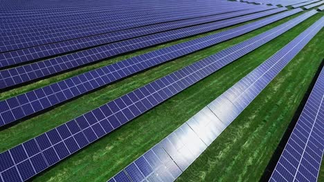 Solar-cells-of-energy-farm-at-sunlight.-Aerial-view-rows-of-photovoltaic-panels