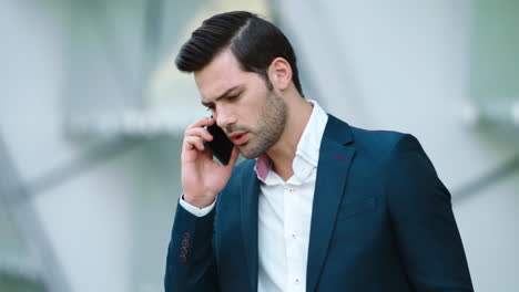 Portrait-businessman-talking-smartphone.-Man-having-business-phone-talk