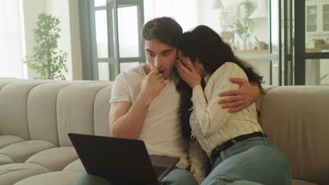 Scared-couple-watching-horror-movie-at-home.-Young-people-watching-scary-video