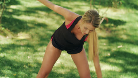 Sport-woman-warming-up-body-before-fitness-training-outdoor