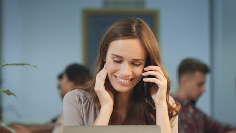 Business-woman-having-informal-telephone-call.-Smiling-lady-chatting-mobile.