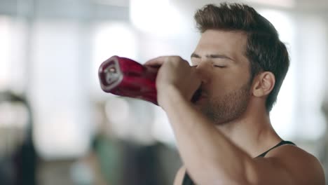 Teen boy drinks water from a bottle, Stock Video