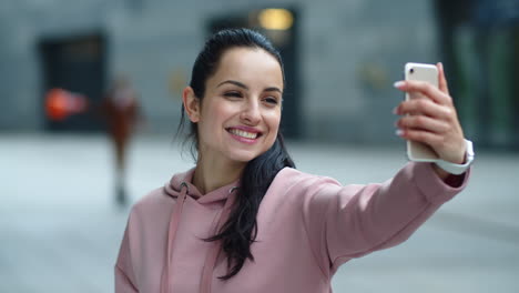 Close-up-smiling-woman-using-phone-for-video-call.-Cheerful-girl-talking-online