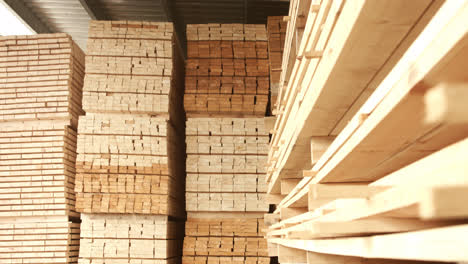 Wooden-boards-stacked-in-warehouse-after-the-process-of-woodworking