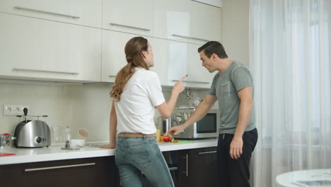 Arguing-couple-having-conflict-at-home-kitchen.